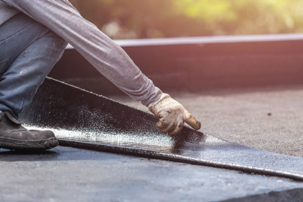 Professional Waterproofing technician working in Montgomery, MI